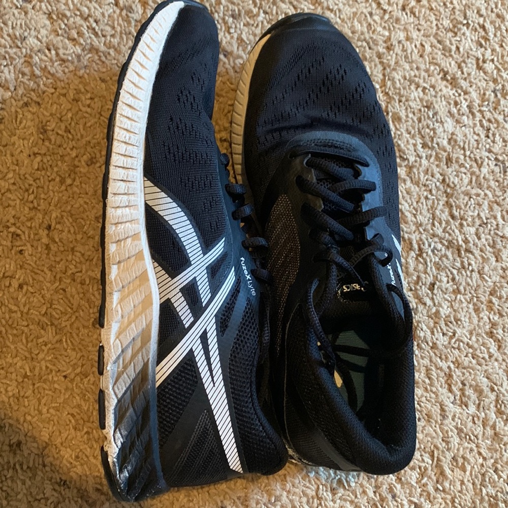 Black ASICS FuzeX Lyte Running shoes. Great condition grew too quickly Size 10